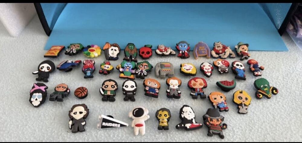 41 Croc Shoe Charms One Raiders Charm , The Rest Are Horror Movie Related.